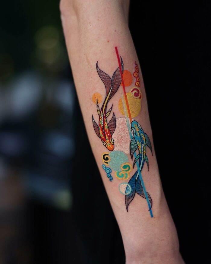 Colorful koi fish tattoo on forearm showcasing a mesmerizing design by a Korean artist.