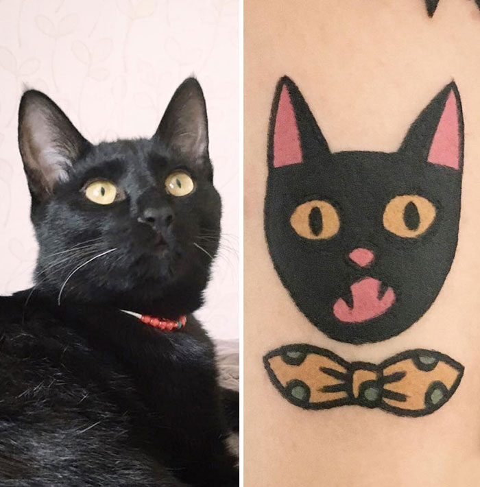 Black cat beside a tattoo showcasing the artist's unique approach to representing animals.