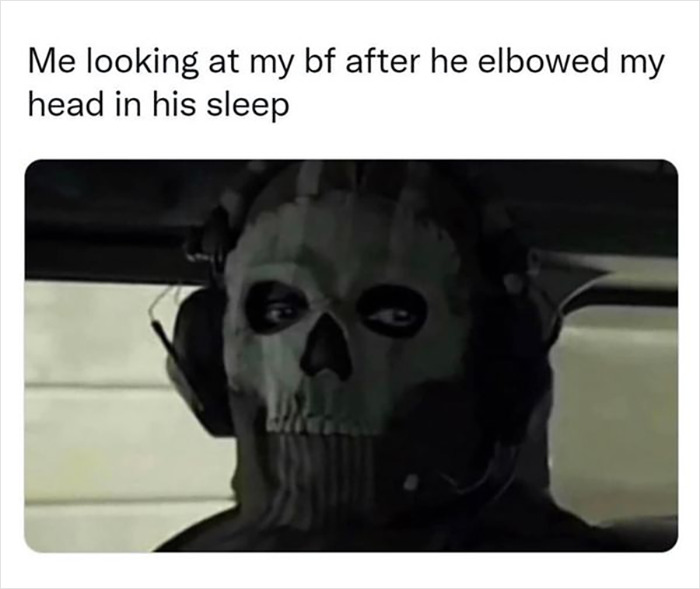 Meme of person in a skull mask, captioned about a boyfriend elbowing in his sleep, exuding humor in relationships.
