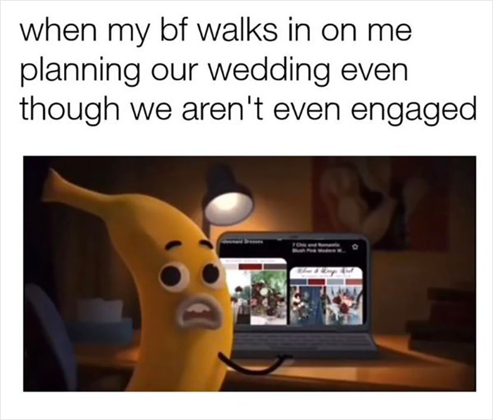 Cartoon banana looking surprised, sitting at a desk with a laptop open, referencing life with a boyfriend.