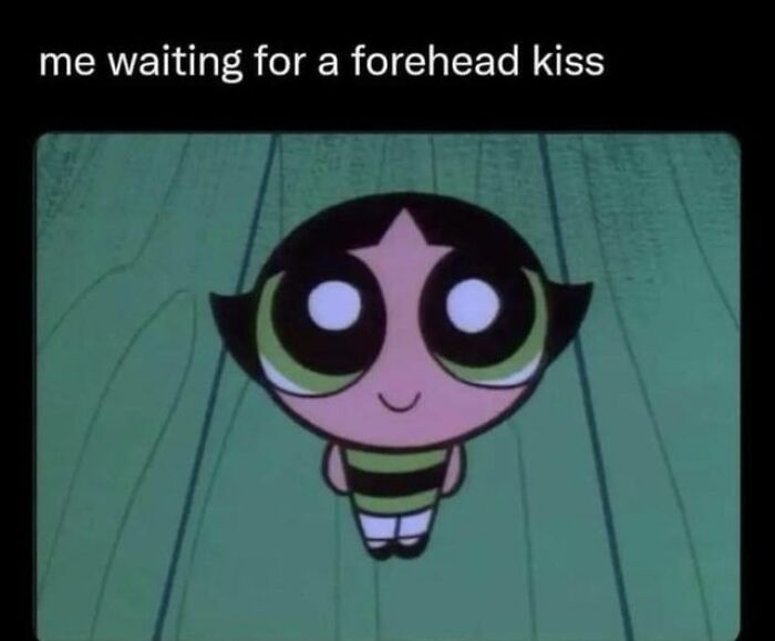 Cartoon character waiting for a forehead kiss, representing life with a boyfriend in a humorous meme.