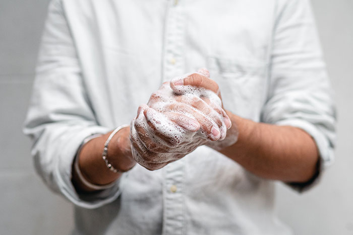 Man Cleaning His Hands With Soap 