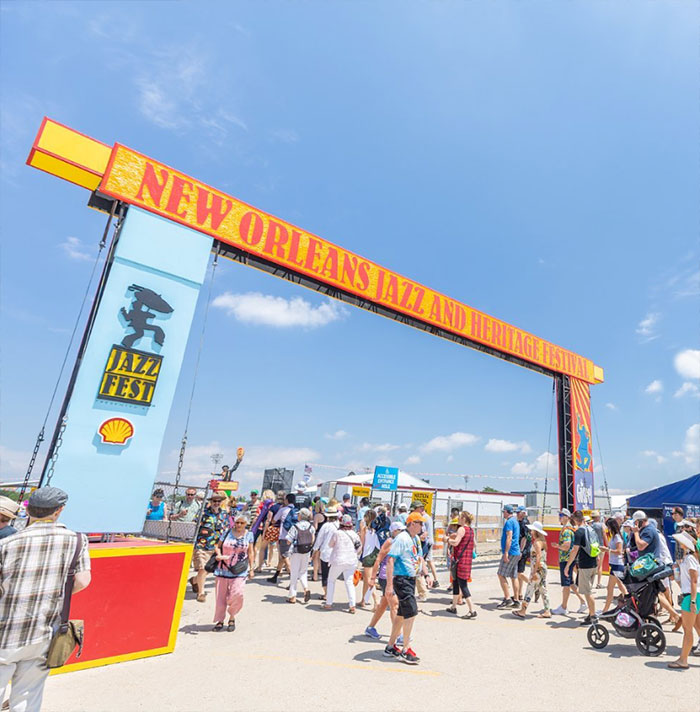 People walk through the festival gates