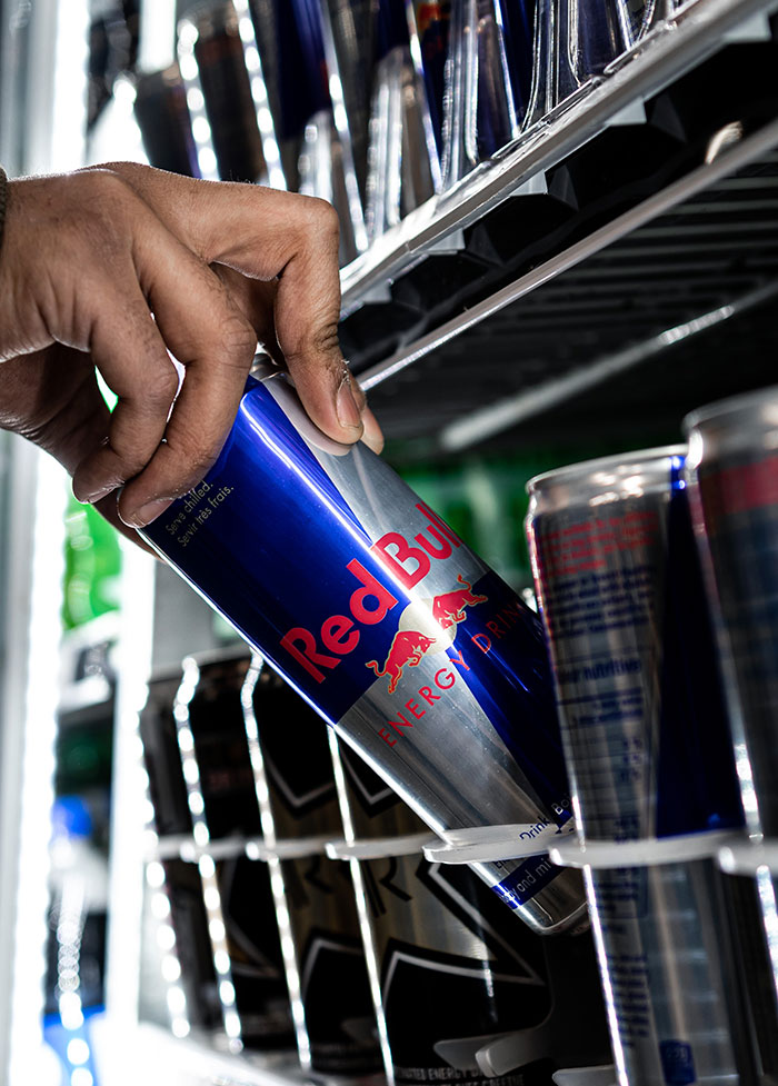 Person taking RedBull drink