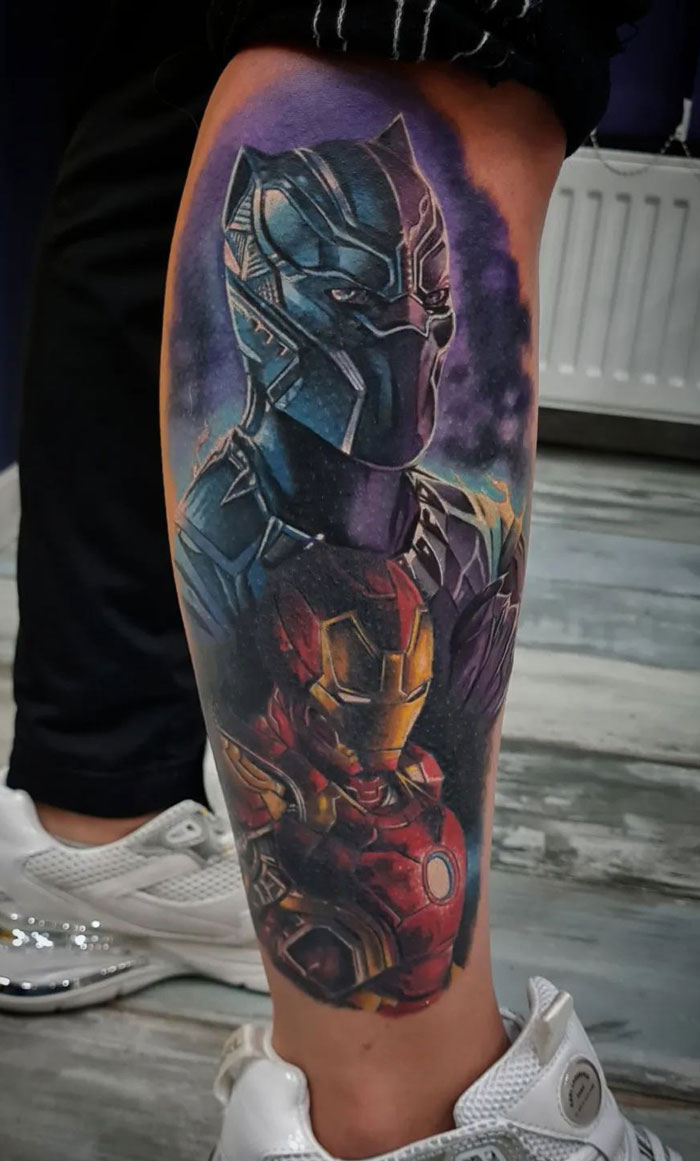 Tattoo of Marvel superheroes on a leg, featuring a vibrant design of iconic characters.