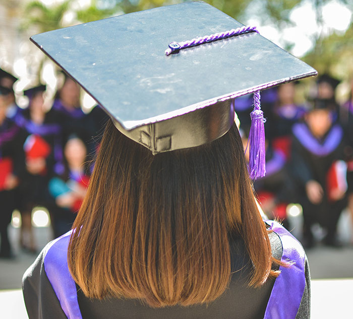 Woman with graduation clothes