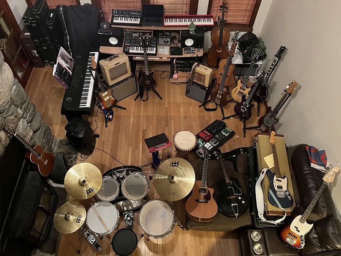 Stringed Instruments. Ten Guitars, Two Basses, Two Banjos, A Mandolin And A Few Oddballs