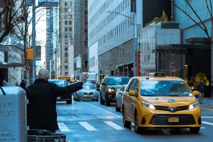 Man Tries To Stop A Taxi Car In The Street 