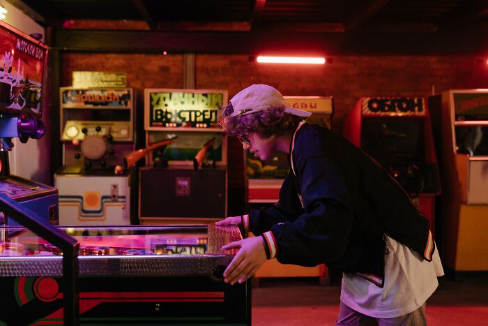 Boy Playing Video Game System In Cellar 