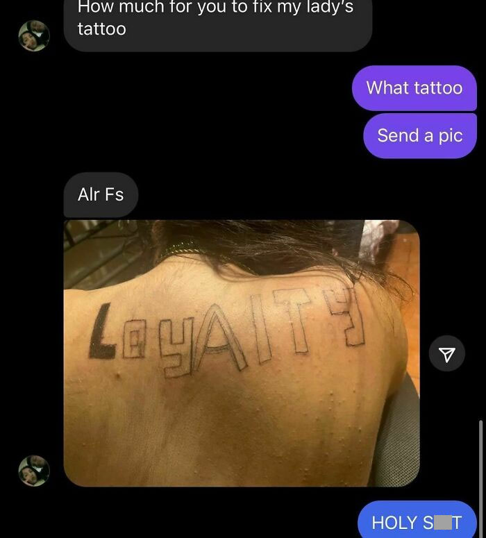 Badly done tattoo on someone's back with misspelled word "Loyality" instead of "Loyalty".