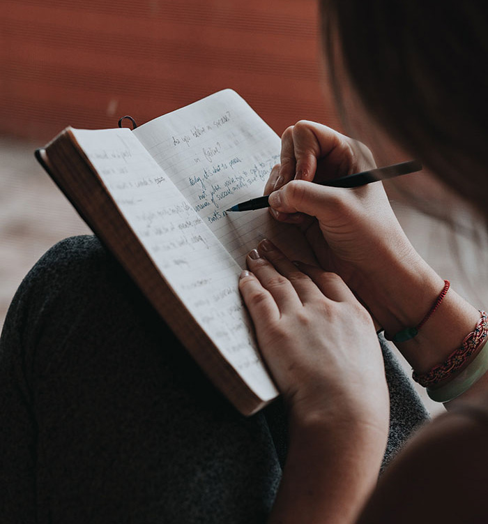 Woman writting in the notebook