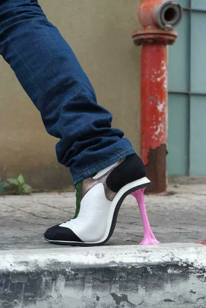 Weird shoes with a chewing-gum style heel, paired with blue jeans.
