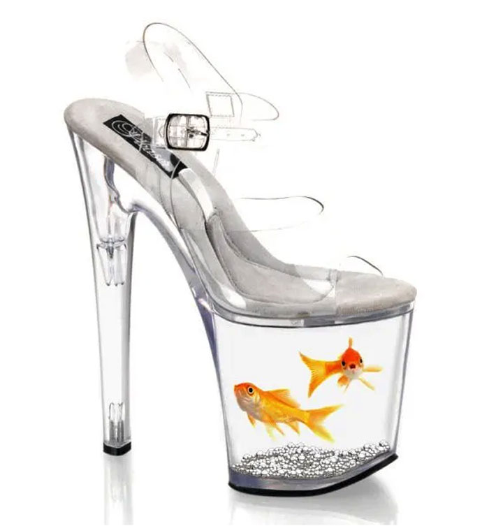 Weird shoes with goldfish in transparent high heels, showcasing unique footwear design.
