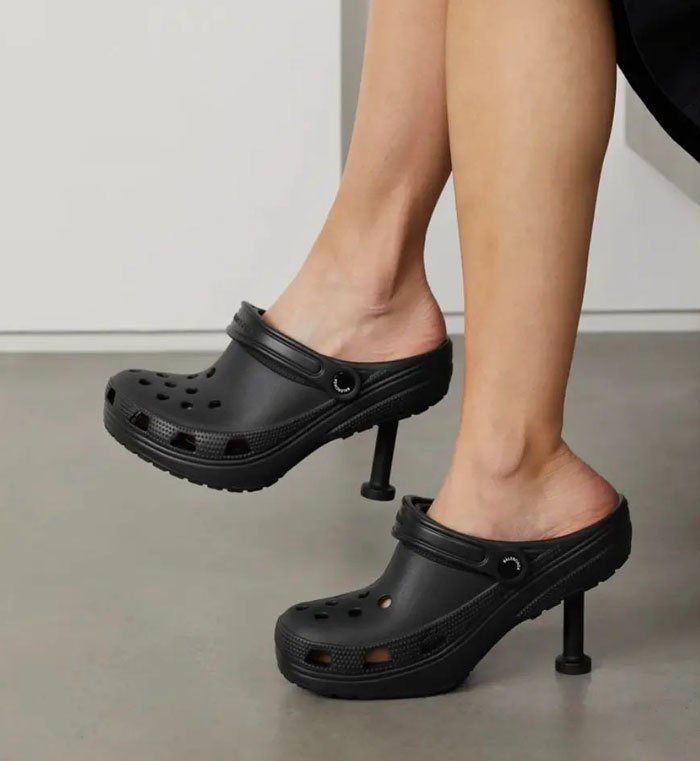 Weird shoes featuring high-heeled black clogs, combining casual and formal styles.
