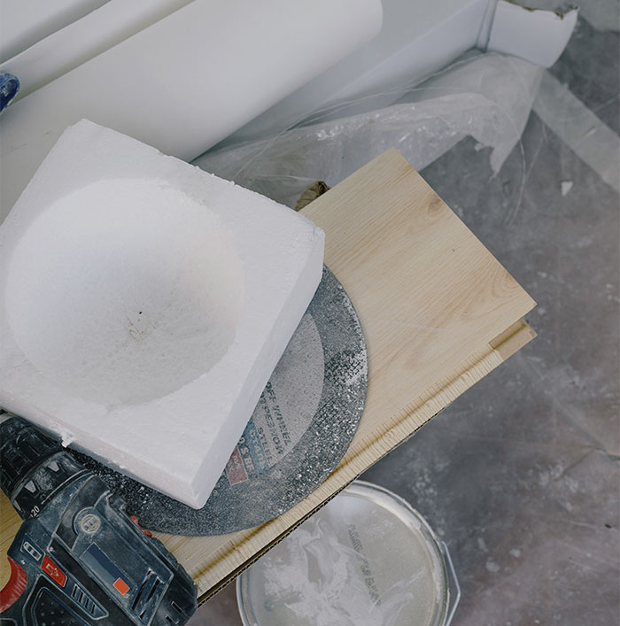 Person crafting with styrofoam