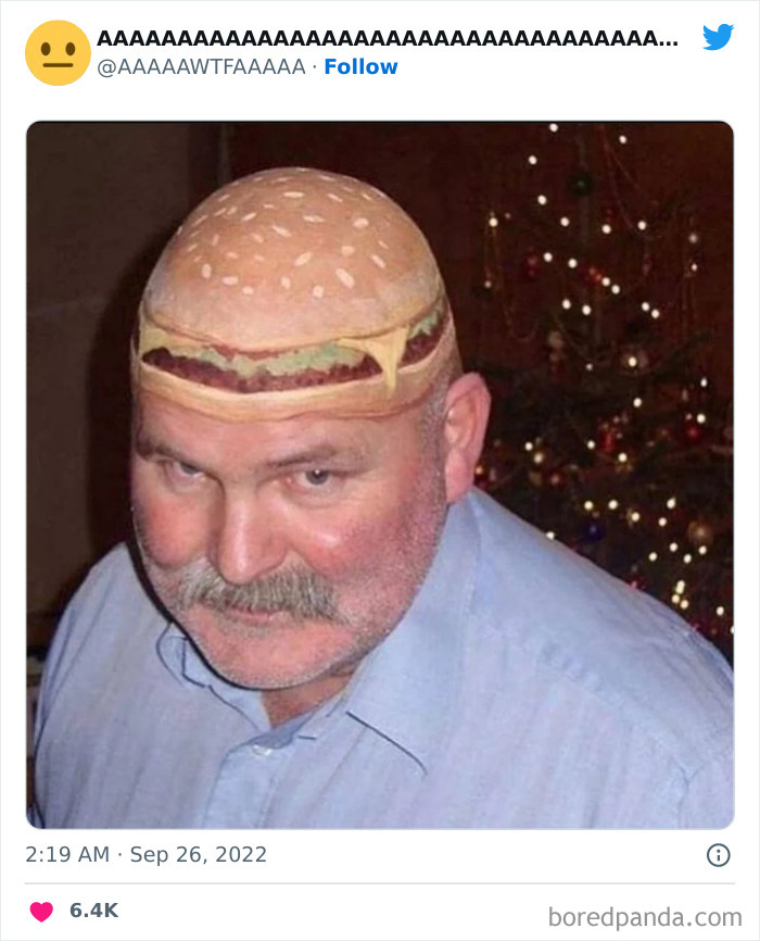 A man with a burger tattoo on his bald head, creating a weird and funny visual.