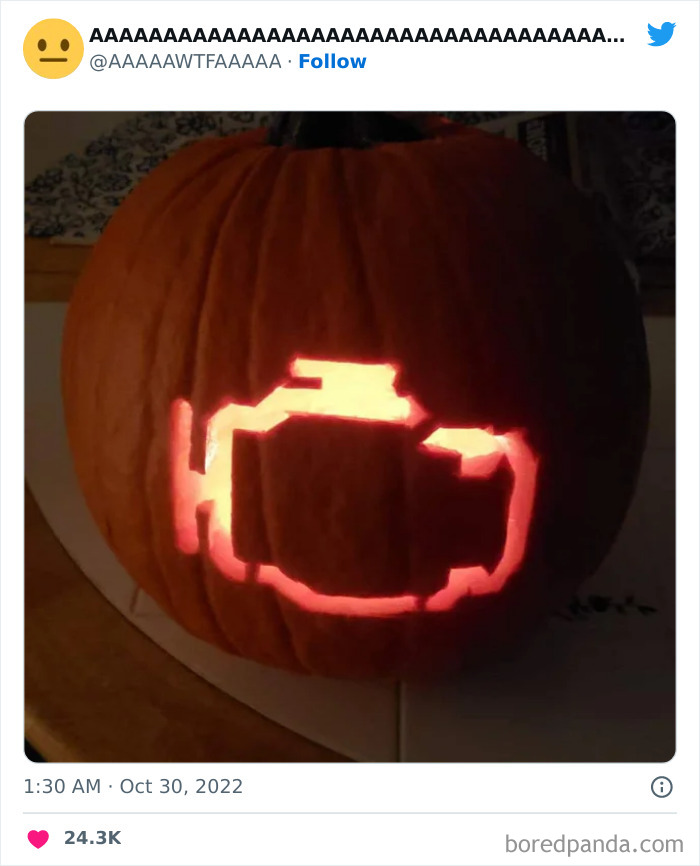 Carved pumpkin with glowing check engine light symbol, shared on Twitter.