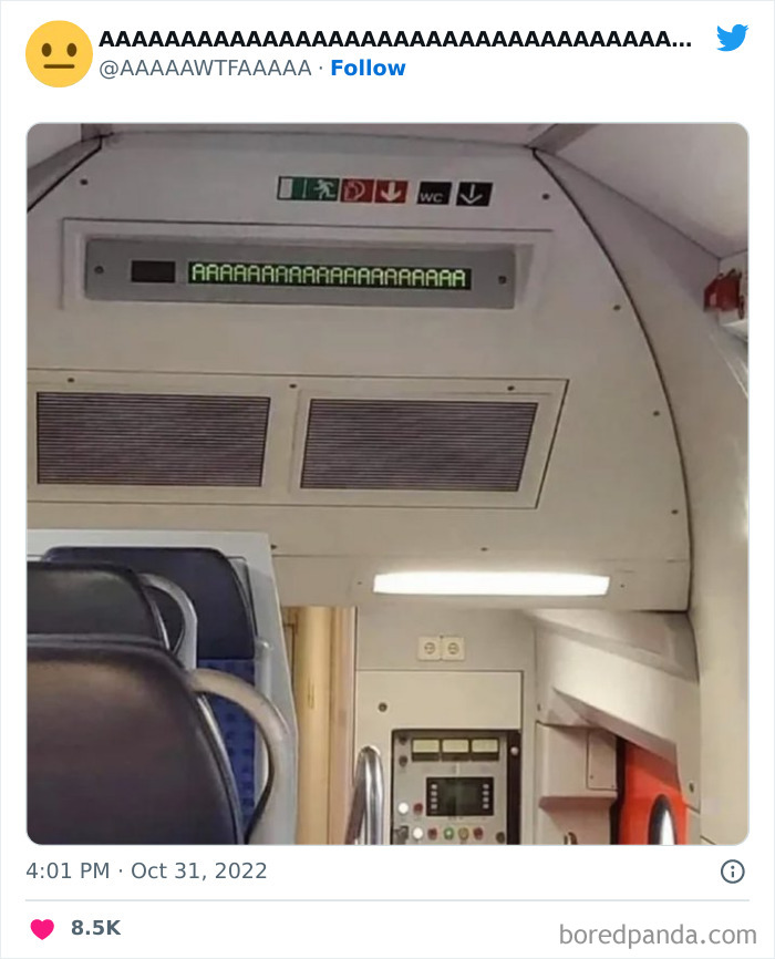 Weird and funny train sign displaying "AAAAAAAA" in a passenger compartment.
