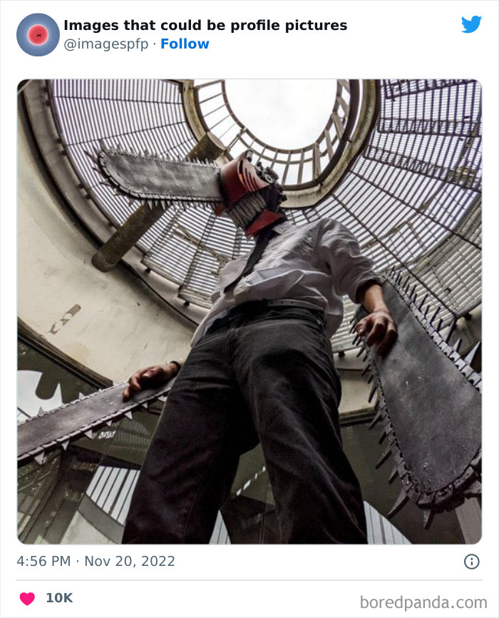 Person wearing a chainsaw mask and holding large saw blades inside a circular cage structure, weird and funny profile picture.