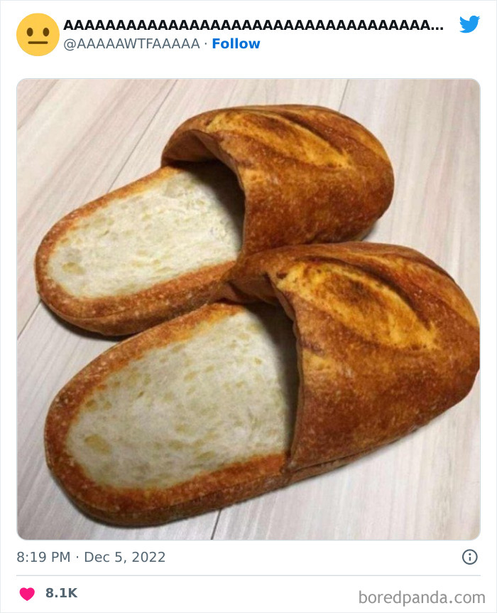 Bread slippers on a wooden floor, showcasing a humorous and weird concept shared on a Twitter account.