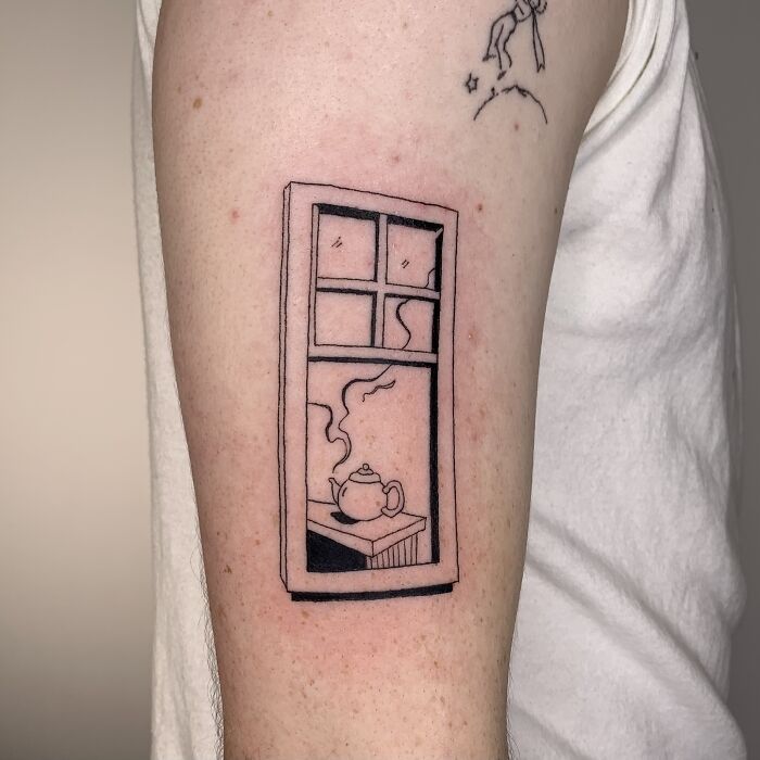 Illustration-style tattoo of a window with a steaming teapot on an arm.