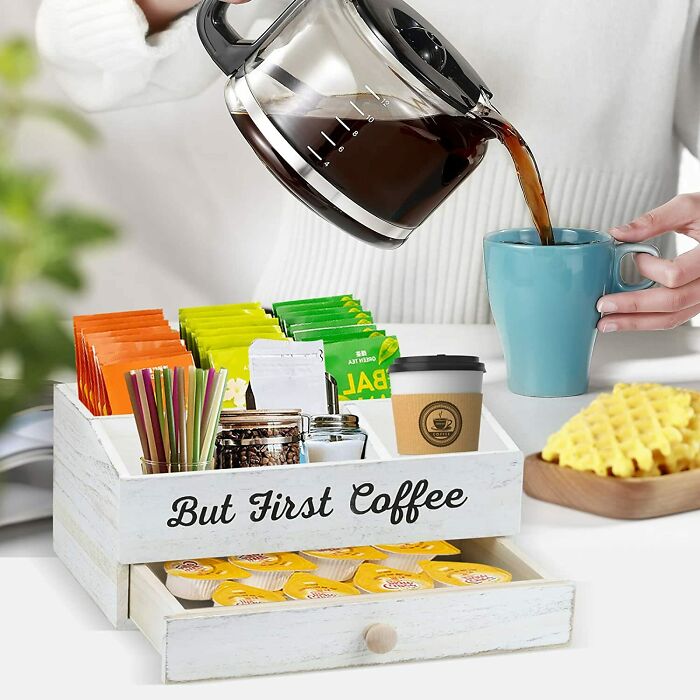 Coffee station organized with assorted teas, sugar packets, and a "But First Coffee" sign for home organization ideas.