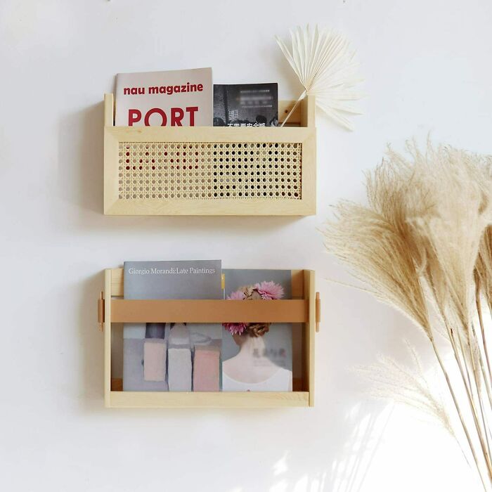 Wall-mounted racks as home organization ideas with magazines and decor.