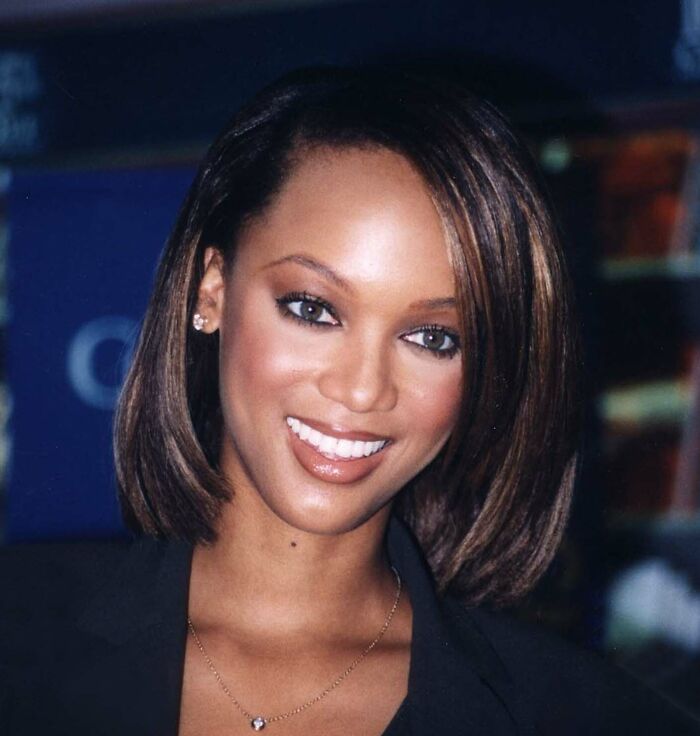 Tyra Banks smiling at an event, representing celebrities who never married yet still found love.