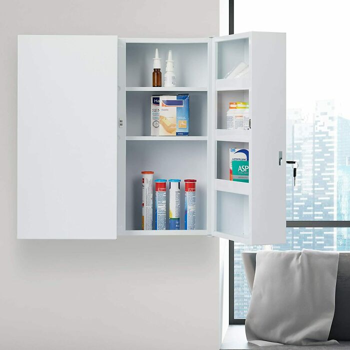 Organized medicine cabinet with shelves displaying assorted health products, offering a clean home organization idea.