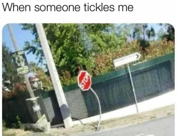Bent stop sign humorously captures relatable meme moment.