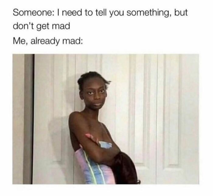 Person in a colorful towel looking unimpressed, embodying relatable meme humor.
