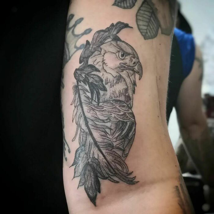 Animal tattoo of an eagle on an arm, showcasing detailed feathers and a fierce expression.
