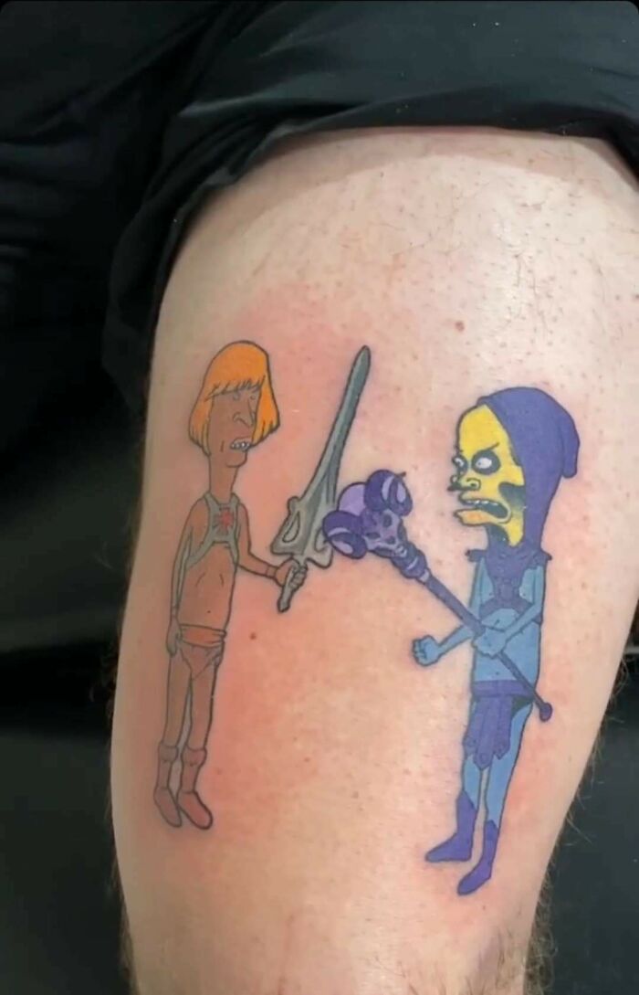 Funny tattoo of cartoon characters with swords on a leg.