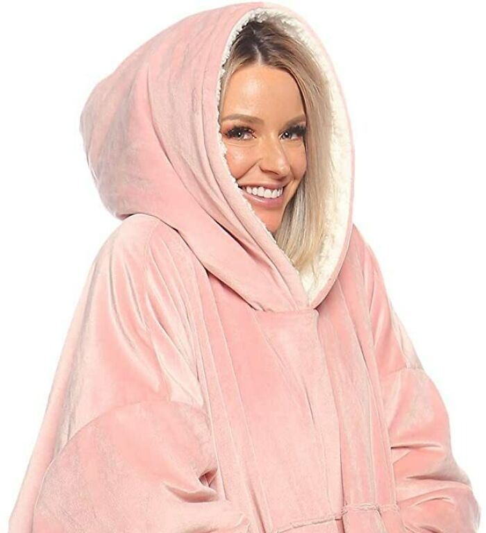 woman wearing pink wearable blanket