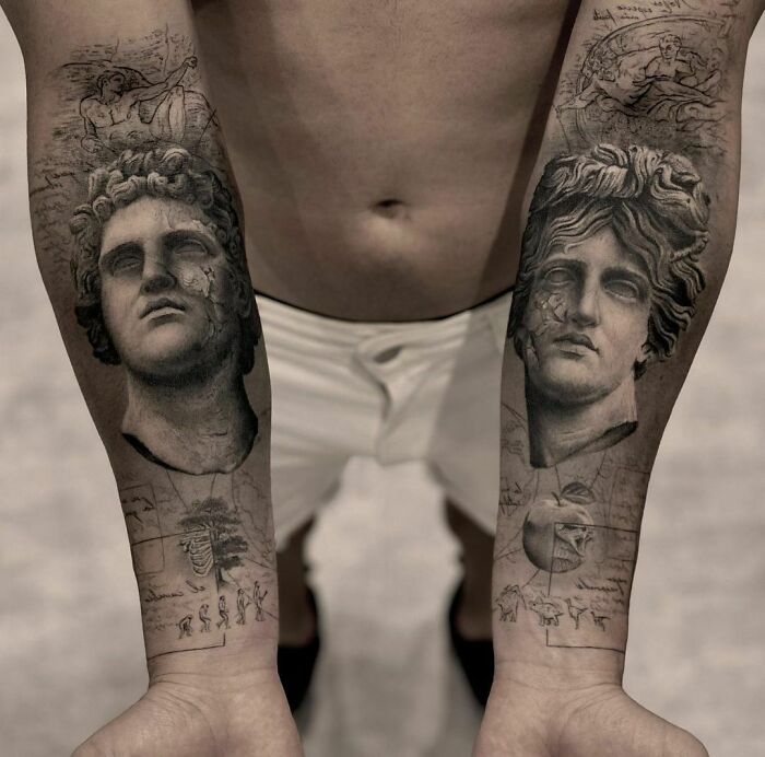 Realistic tattoos of classical busts on forearms, detailed and museum-worthy.