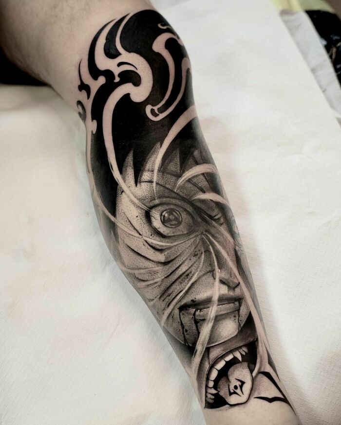 Realistic leg tattoo featuring intricate black and gray design, resembling museum-quality artwork.