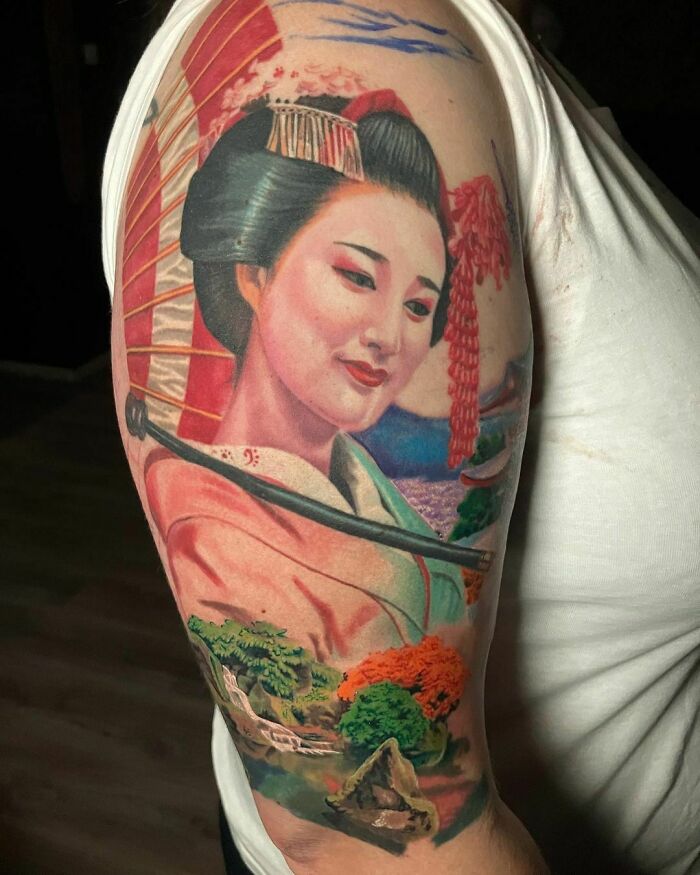 Realistic tattoo of a geisha on an arm, showcasing vibrant colors and intricate details.