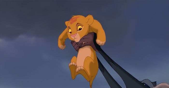 Simba is hold by Rafiki