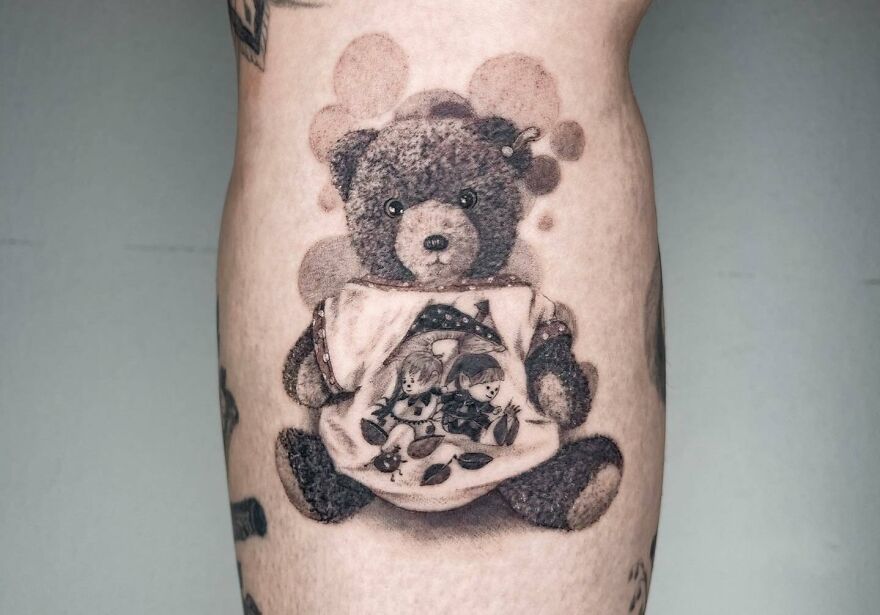 Realistic teddy bear tattoo with intricate detail, exemplifying museum-quality artistry on skin.