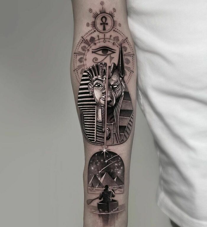 Realistic tattoo of an Egyptian theme on an arm, featuring a pharaoh and pyramids, showcasing flawless artistry.