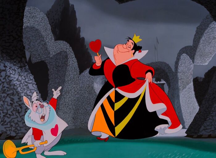 Queen Of Hearts holding a heart 