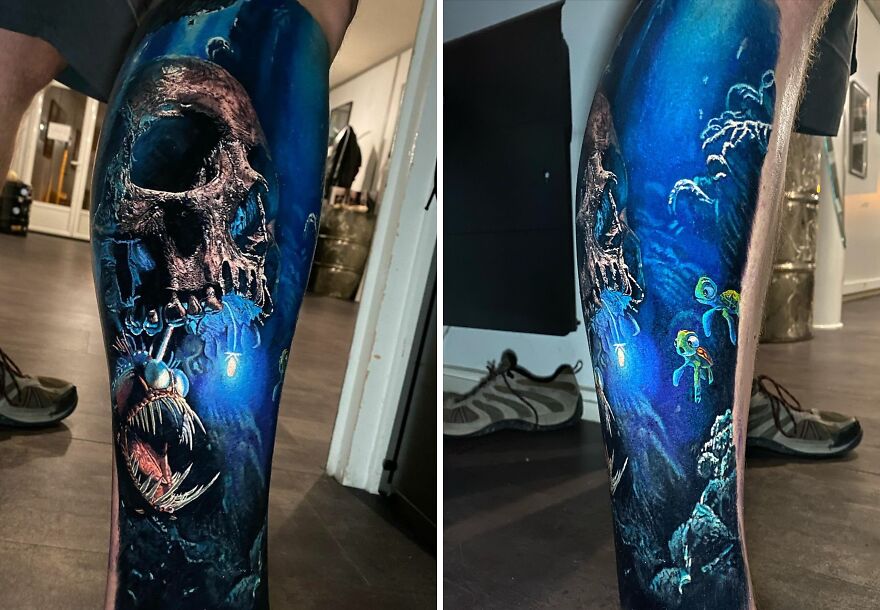Realistic tattoo featuring a glowing deep-sea skull and anglerfish in vivid blue hues.