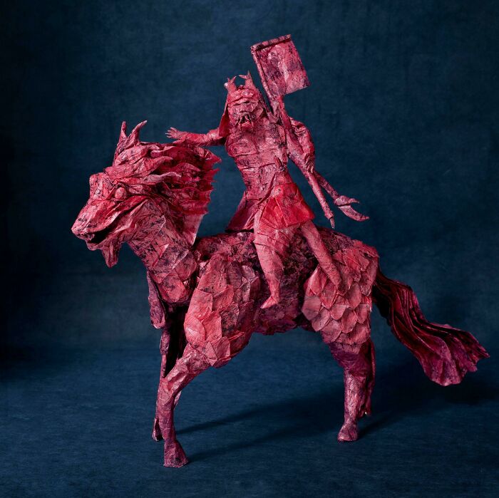 Samurai riding a kirin made out of a red paper