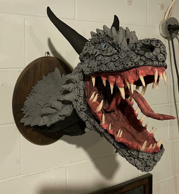 the head of the dragon made out of the paper hanging on the wall