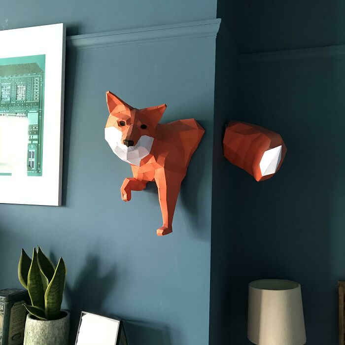 red and white paper fox in the wall