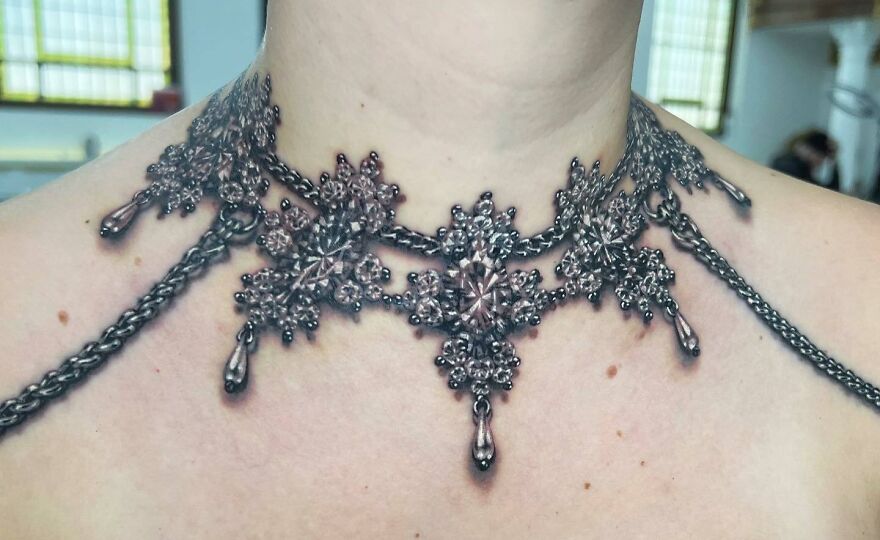 Realistic metallic choker tattoo on neck with extensive detailing, showcasing 360 wraparound design.