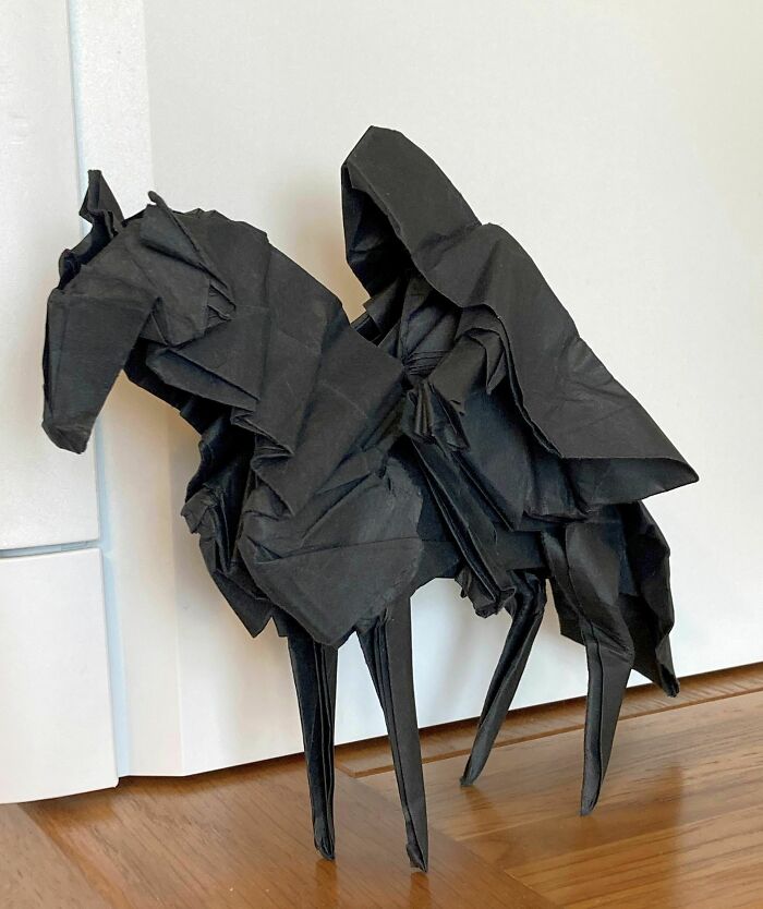 rider on the horse made out of a black paper