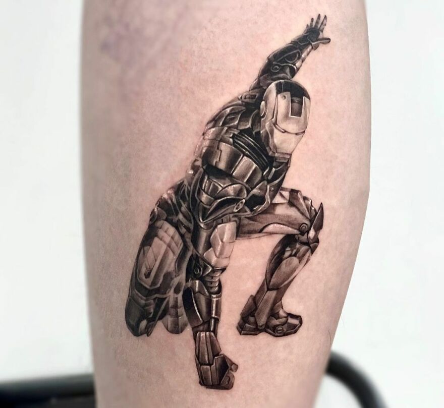Realistic tattoo of a detailed armored figure in a dynamic pose on forearm.