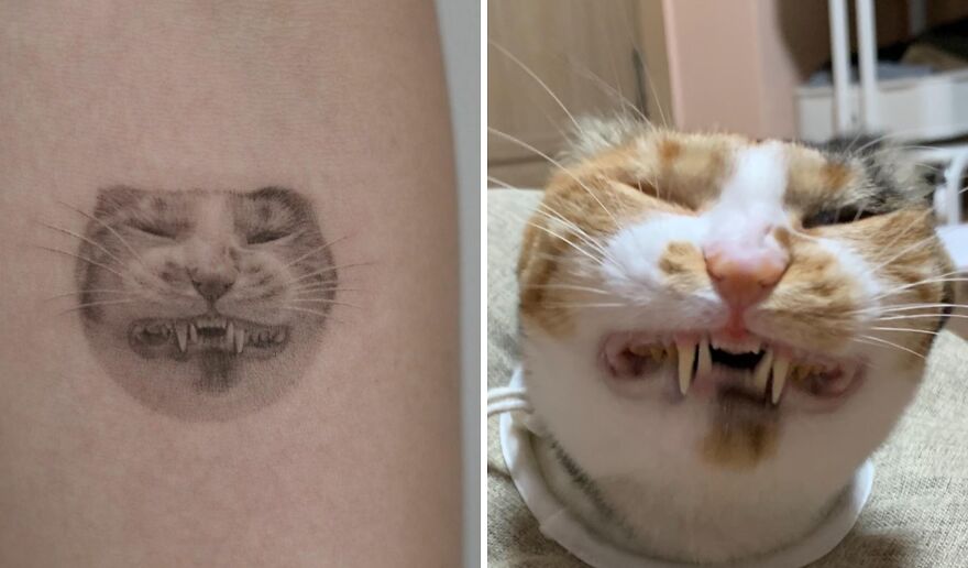 Realistic tattoo of a cat's face with fangs, showing incredible detail and lifelike artistry.