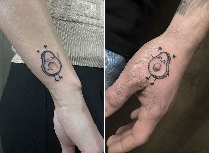 Matching avocado tattoos for couples, featuring cute designs with hearts on two different wrists.
